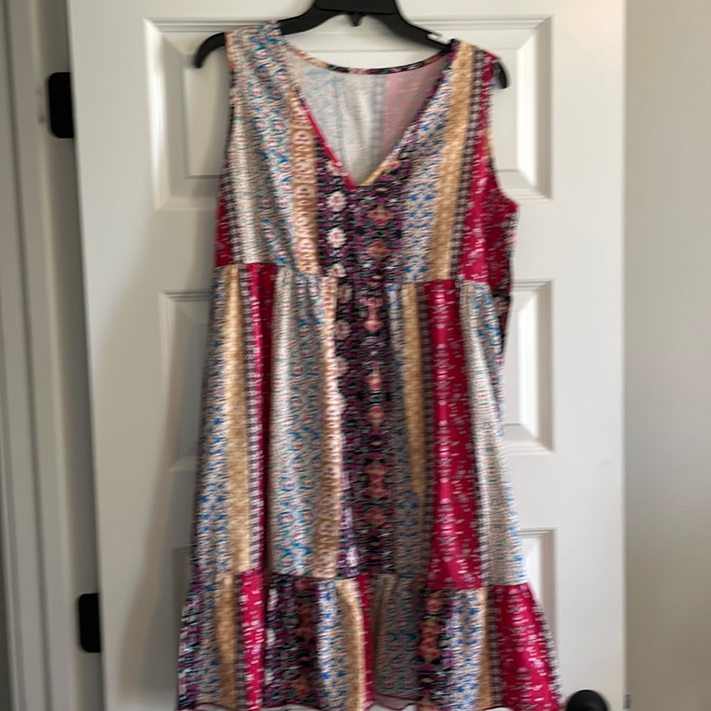 Sleeveless dress. Size L Never worn. Boutique dress.